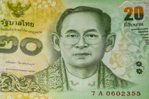 Detailed close-up image of a Thai 20 baht banknote featuring an engraved portrait.